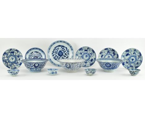 A collection of mixed Qing dynasty blue and white ceramics. The lot comprising three bowls decorated with abstract motifs, a 