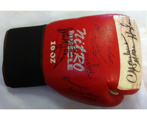 BOXING: A red and white Nitro Muscle boxing glove individually signed by seven boxers, some of them World Champions in variou
