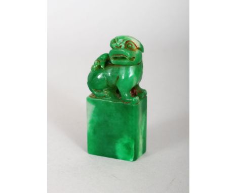 A CHINESE JADE FOO DOG SEAL. 2.5ins high.