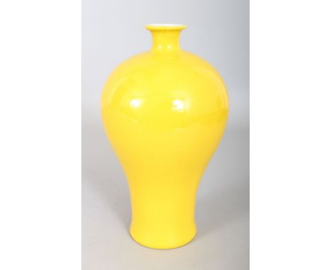 A CHINESE YELLOW PORCELAIN BALUSTER VASE, with seal to base. 9ins high.