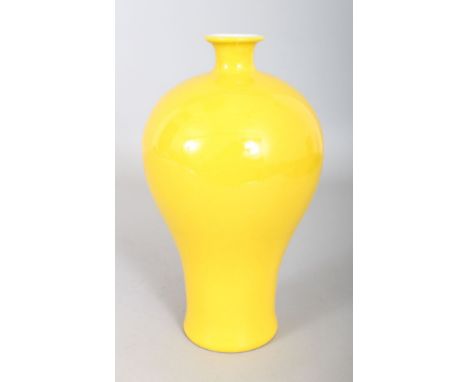 A CHINESE YELLOW PORCELAIN BALUSTER VASE, with seal to base. 9ins high.