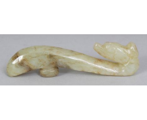 A CHINESE CELADON JADE BELT HOOK, 3.25in long.