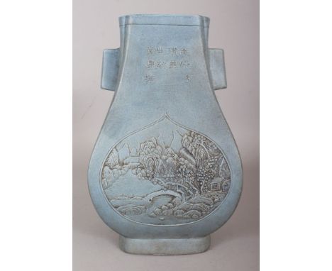 AN UNUSUAL CHINESE BLUE GLAZED FANGHU PORCELAIN VASE, the sides moulded with calligraphy above teardrop landscape panels, the