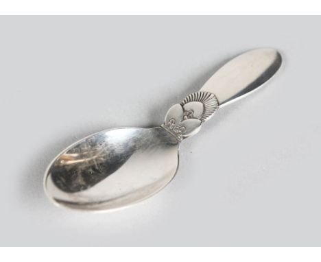 A GEORG JENSEN STERLING DANISH SILVER "CACTUS" PATTERN CADDY SPOON.