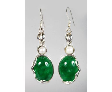A PAIR OF SILVER AND JADE EARRINGS.