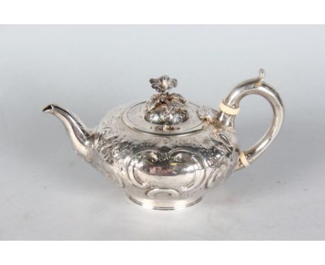 A VICTORIAN CIRCULAR SHAPED TEAPOT with floral repousse decoration. London 1870.  Maker: Hardy & Son.  Weight 12ozs.