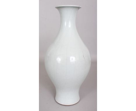 A CHINESE RU STYLE CRACKLEGLAZE PORCELAIN BALUSTER VASE, the base with a Qianlong seal mark, 12.1in high.