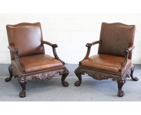 A VERY GOOD PAIR OF CHIPPENDALE DESIGN LIBRARY CHAIRS, with leather backs and sides, carved arms, frieze and legs ending in c