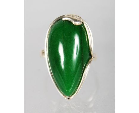 A SILVER AND JADE RING.
