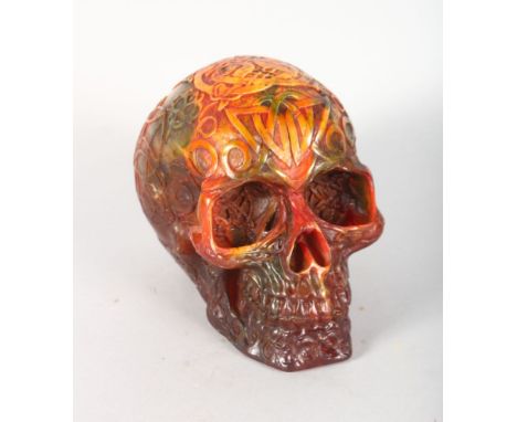 A CARVED AMBER SKULL. 5.5ins high.