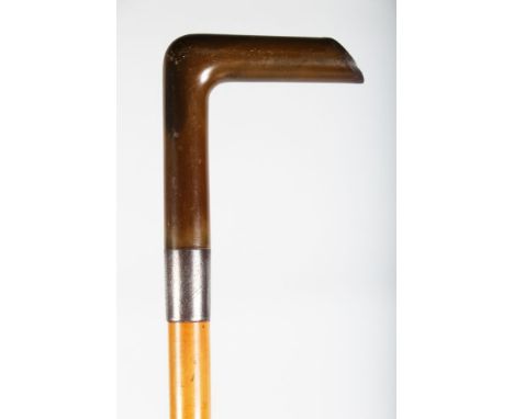 A WALKING STICK WITH RHINO HANDLE.