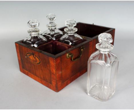 A GOOD GEORGIAN MAHOGANY SQUARE DECANTER BOX, crossbanded with shell inlay and four decanters (one AF). 8ins.