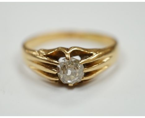 An 18ct gold and claw set solitaire diamond ring, size L, gross weight 3.5 grams.