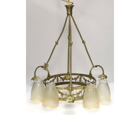 A brass three branch (four light) electrolier and four etched glass shades, 64cm high