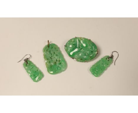 Four items of white metal mounted carved jade jewellery, comprising a brooch, 37mm, a pendant and pair of earrings. Small hai