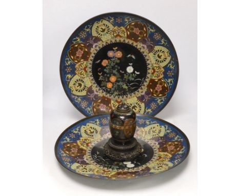 Two Japanese cloisonné enamel chargers and a finer cloisonne jar and cover on stand, largest 46cm (2) Several imperfections a