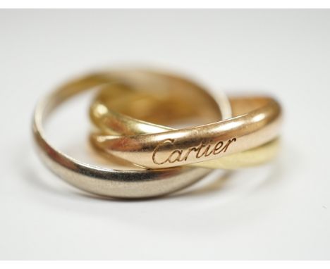 A modern Cartier three colour 750 Russian wedding ring, signed and numbered GW3090, size P, 9.7 grams, with Cartier certifica