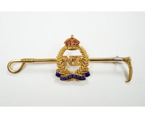 A 1940's 9ct, plat. and two colour enamel set New Zealand Infantry and riding crop sweethearts bar brooch, with engraved insc