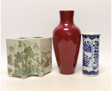 An early 20th century Chinese blue and white cylindrical vase, a ruby ground vase and an enamelled porcelain double lozenge v