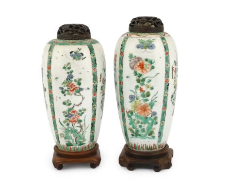 A near pair of Chinese famille verte jars, Kangxi period, on wood plinths, blue enamels repainted Both structurally good; som