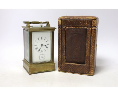 A cased early 20th century brass repeating carriage clock with alarm, 15.5cm