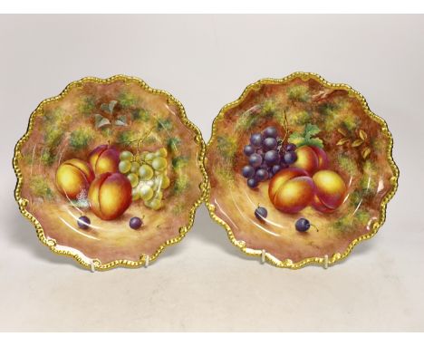 A pair of Royal Worcester fruit painted plates, post war, signed Freeman, 22.5cm Both near-excellent.