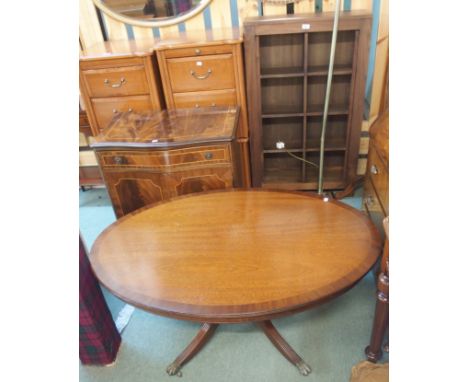 A modern open bookcase, a reproduction mahogany two door cabinet, an oval mahogany coffee table and a floor lamp (def)  (4) C