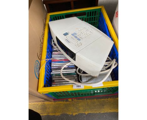 A Box of CD'S Together with a Bose Radio/ CD Player. 