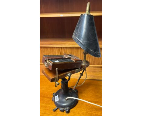 Antique unusual desk top lamp, Fitted with a wooden camera style block. Possibly used for projection of slides. [In a working