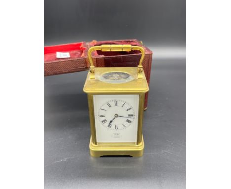 Antique Brass and bevel glass carriage clock, French single barrel movement. Enamel face- Examined by Dent, London. Comes wit
