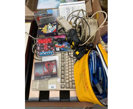 A Vintage Commodore Amiga console with various games and joy stick. Includes Back to the future II Game, The Night Breed, Sha