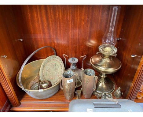 A Shelf of brass wares to include Art Nouveau arts and crafts vases- with stamp to base. Brass paraffin lamp, Primus style st