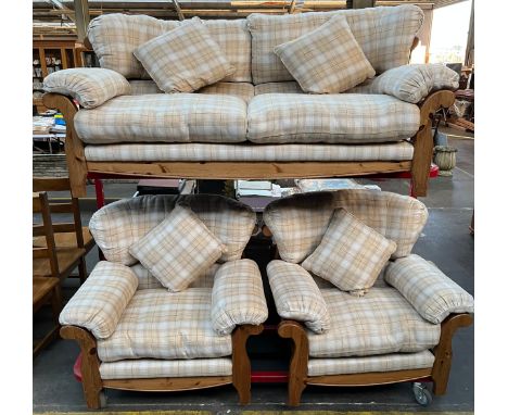 A Pine Ducal three piece sofa set. Cream tartan design material upholstery cushions. 