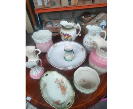 A Collection of antique water jugs and large porcelain basin 