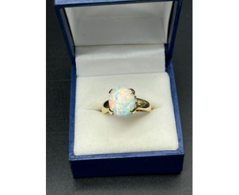 9ct yellow gold ladies ring set with a large opal stone. [Ring size N] [3.45Grams] 