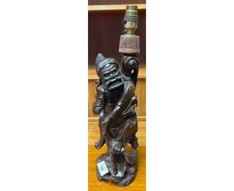 A Chinese hand carved root wood figural table lamp. [37cm high] 