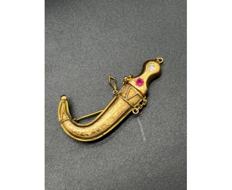 18-24ct gold Jambiya Dagger brooch set with a round ruby and faux diamond. [10.54grams] [Tested positive for 18-24ct gold]