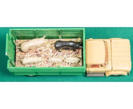 2 Corgi Toys. A Car Transporter with Ford Tilt cab 'H' Series Tractor (1138). In red, mid blue and pale blue livery, cab with