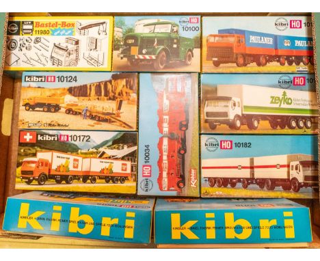 10 Kibri HO scale model kit. Mainly lorries or construction vehicles, including a DAF artic with tilt trailer. Kaelble heavy 