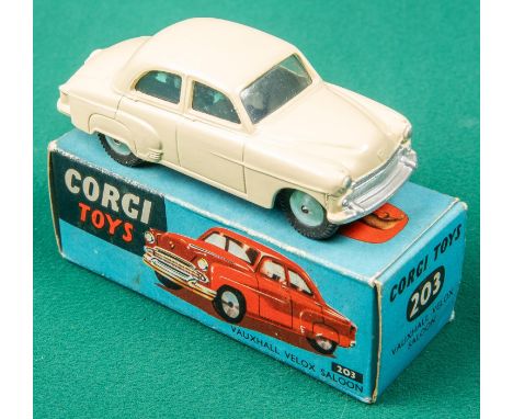 A Corgi Toys Vauxhall Velox Saloon (203). With cream body, spun wheels and black rubber tyres. Boxed with all end flaps 6/10.