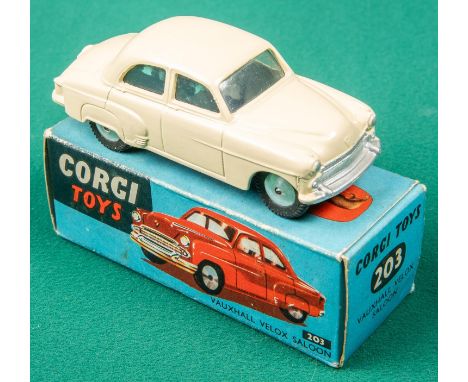 A Corgi Toys Vauxhall Velox Saloon (203). With cream body, spun wheels and black rubber tyres. Boxed with all end flaps 6/10.