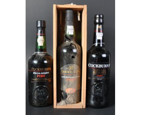 Three bottles of Cockburn's port comprising two bottles of Special Reserve and one bottle of 1997 late bottled vintage LBV. A