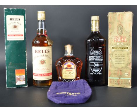 Three bottles of assorted alcohol comprising a Seagram's Crown Royal blended Canadian Whisky 13 1/3 Fl Oz 40% vol in pouch, b