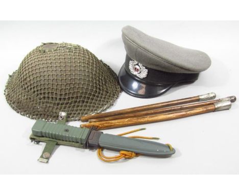 Three various foreshortened swagger sticks, with metal ends, 37cm wide, a dagger and scabbard with Super Mark button, NVA 57 