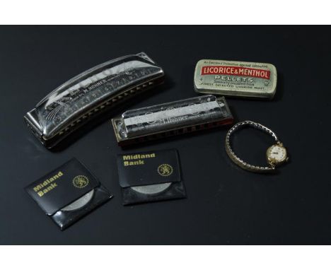 An early 20thC Hohner Echo chrome plate smaller mouth organ harmonica, in outer box, opening at the centre, 14cm wide, and an