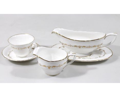 A Royal Worcester Gold Chantilly part dinner service, comprising of two lidded vegetable tureens, 30cm wide, three graduated 