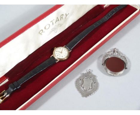 A ladies Rotary cocktail watch, with Arabic and baton numerals and 1.5cm dia. dial with black leather strap, in Rotary case, 