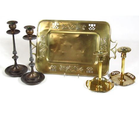 A 20thC Art Nouveau design brass tray and candlestick set, each piece of part pierced outline, the tray 38cm wide, and two fu
