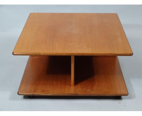 A teak G-Plan style coffee table, the overhanging top raised above a shelf beneath, 40cm high, 41cm wide, 78cm deep.