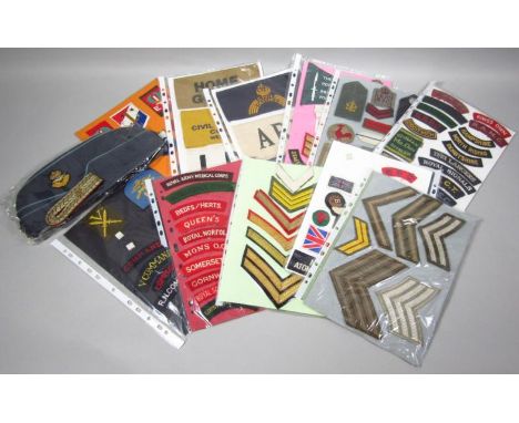 Various military army and other related iron on cloth badges, to include Dutch EM Badge, for Civil Defence Corp, 19cm wide.  